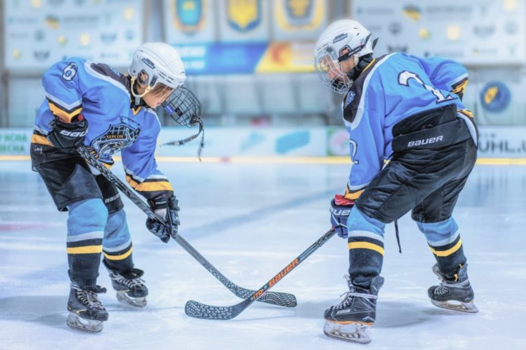 Young ice hockey players during training