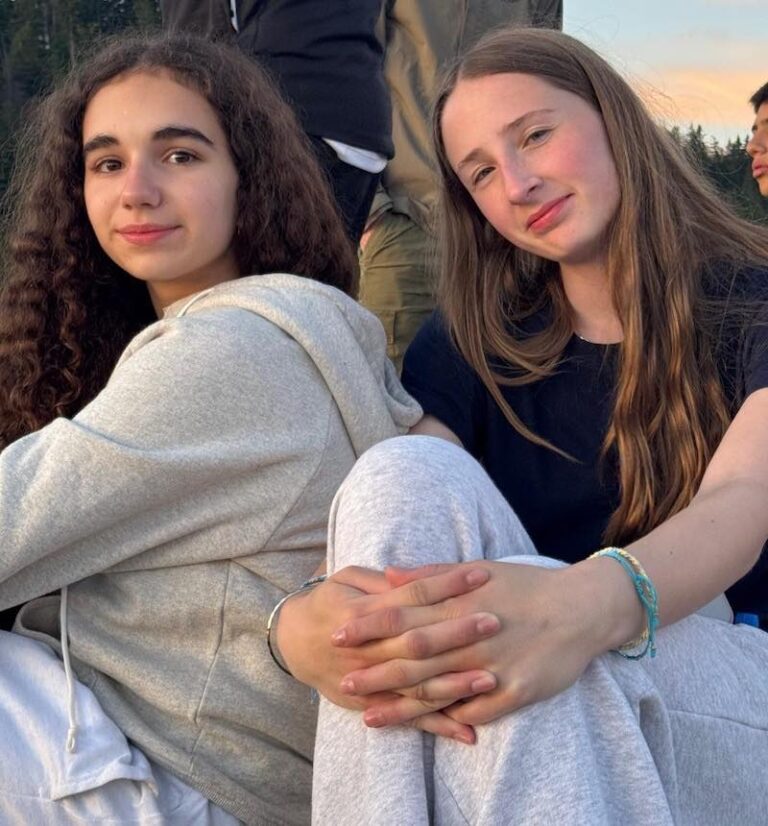 Two students sitting outdoors during Chantemerle summer camp